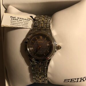 Seiko Gold and Silver Watch with Roman Numerals cabochon crown 50 mm water resis